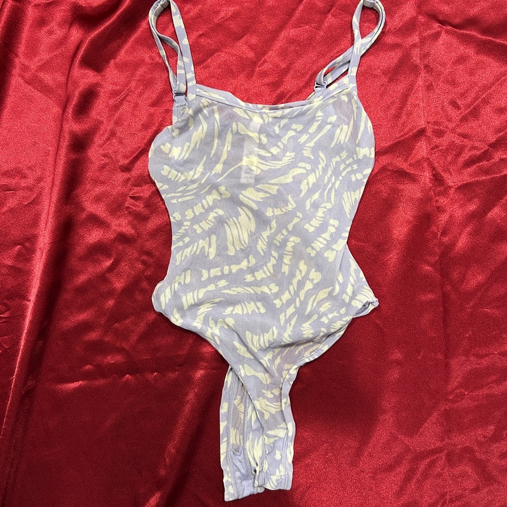 Sheer skims mesh body suit
